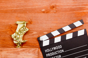 Theatrical masks and movie clapper