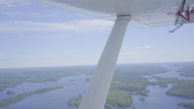 nature canada ontario wilderness forest lake float plane flying over