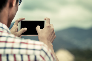 Man hand using cellphone,smartphone,phone to take photo