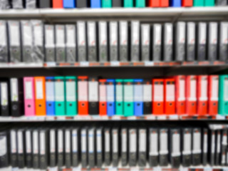 Shelf in a office with many files blur background