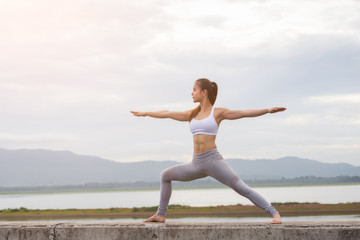 Fototapeta premium Asia woman doing yoga fitness exercise