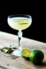 The glass of alcoholic cocktails Daiquiri consists of rum on the leaves of lime, elderflower syrup...