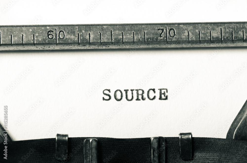 Fototapete word source typed on typewriter