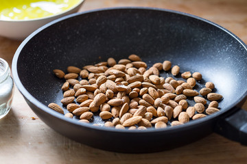 Almonds with Salt in Black Pan, Close-up View