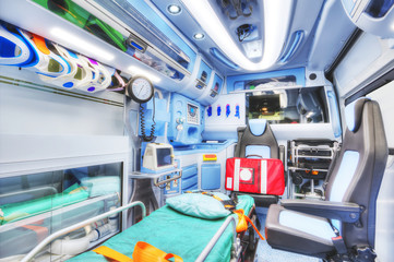 Interior of an ambulance. HDR version. High key. Soft focus. - obrazy, fototapety, plakaty