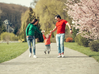 Happy family in blooming park