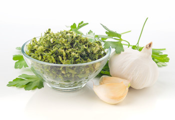 chopped garlic and parsley with garlic cloves