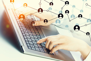 Woman typing on keyboard . Mixed media