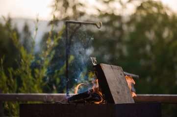firewood and grill for barbecue. kindling fire