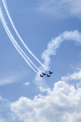 Airplanes on air show with smoky trail