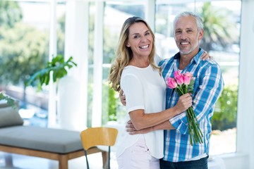 Mature couple embracing in restaurant