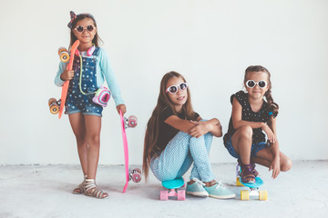 Children with skatboards © Alena Ozerova