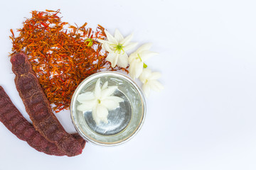 water in silver bowl with Jasmine Safflower and Acacia concinna, Thailand Songkarn festival...