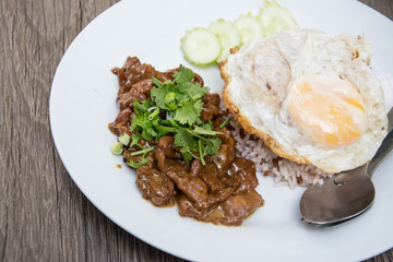 Braised pork on rice with fried egg
