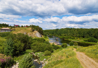 Fototapeta na wymiar View of the river Chusovaya . Sunny summer day summer clouds rocks, central ural, russian nature