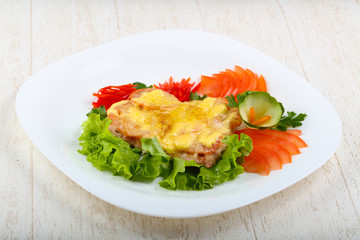 Pork steak with tomato and cheese