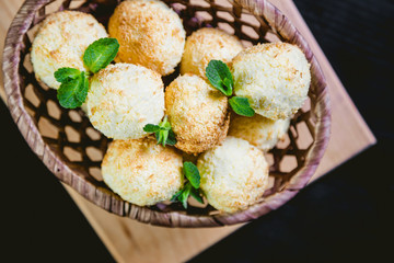 Coconut cookies in a basket with mint, a tasty dessert