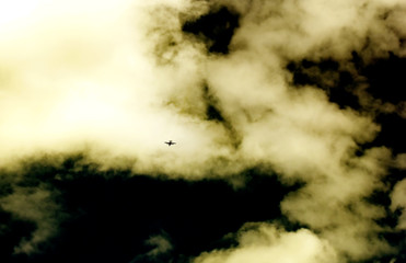 Plane in stormy sky