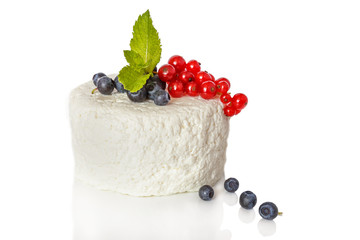 cottage cheese with currant and blueberries on a  white background with shadow and reflection - 115299668