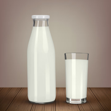 Bottle of fresh milk and glass is wooden table