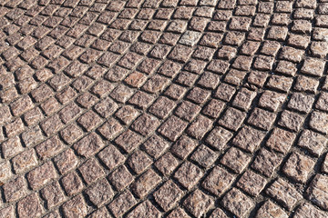 Brown cobblestone street pavement, texture