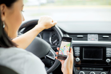 Driver using navigation app on mobile phone