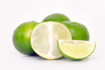 Fototapeta na wymiar Lemon or lime fruit with half cross section and partial section