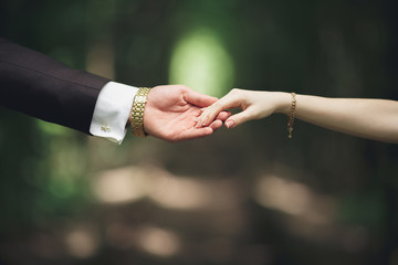 Wedding couple bride and groom holding hands