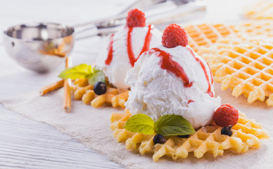 Ice Cream with Mint and waffles. Homemade Organic product. On the wooden table.