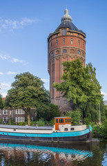 Old water tower at a canal in Groningen