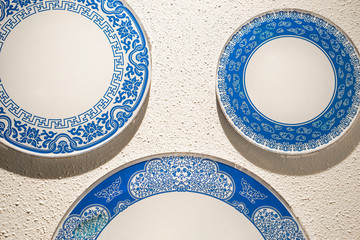 Porcelain chinaware on the white wall