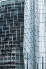 Obraz premium Skyscrapers with glass facade. Modern buildings in Paris business district. Concepts of economics, financial, future. Copy space for text. Dynamic composition.