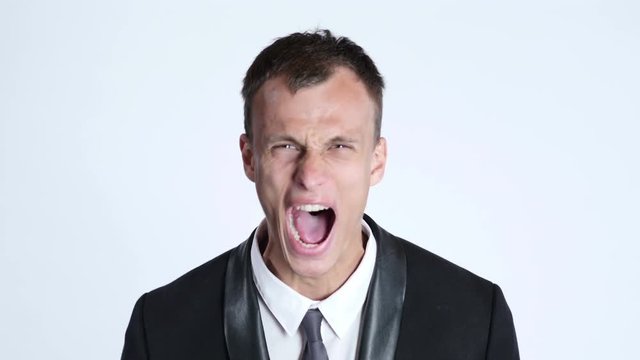 portrait of businessman in anger screaming