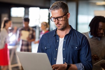 Man using laptop in office