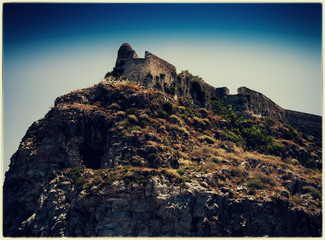 Fototapeta na wymiar Horizontal vintage abandoned castle on the rock hill landscape p