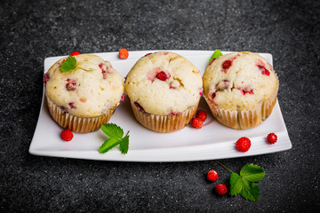 Homemade strawberry muffins in paper cupcake holder