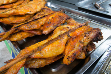 The roasting chicken inserts the wood , delicious food of a Thai
