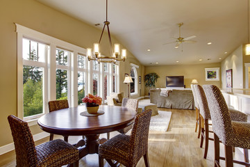 Open plan interior with lots of space. View of dining room and living room.