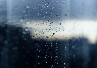 Rain drops on glass reflection