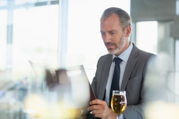 Businessman looking at menu
