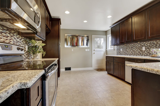 Modern Kitchen Interior With Dark Brown Storage Cabinets