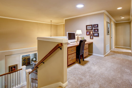 Small home office in the hallway with carpet floor