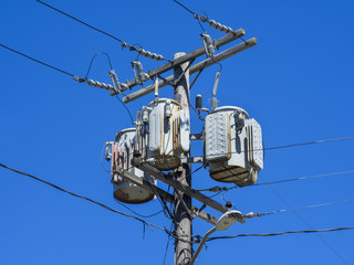 Electric transformer on blue sky