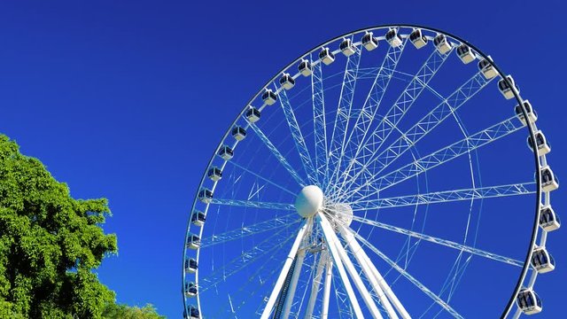 Large white ferris wheel with clear blue sky at Southbank, Brisbane, Australia
