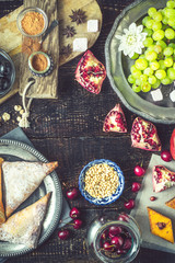 Different sweets on the wooden table top view