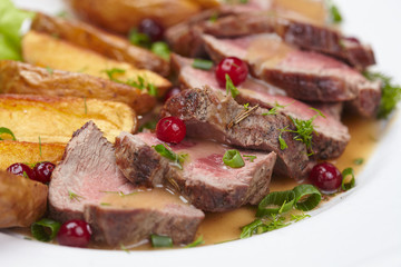 Tasty roasted pork meat with potatoes