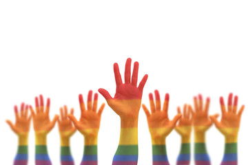 Rainbow multi-color flag pattern on blur many people human hands raising upward isolated on white background (clipping path) 