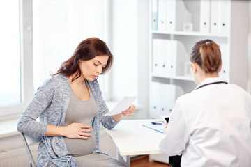 gynecologist doctor and pregnant woman at hospital