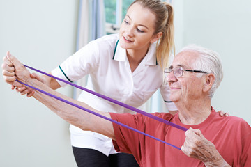 Senior Male Working With Physiotherapist - obrazy, fototapety, plakaty