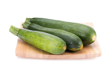 green zucchini vegetables isolated on white